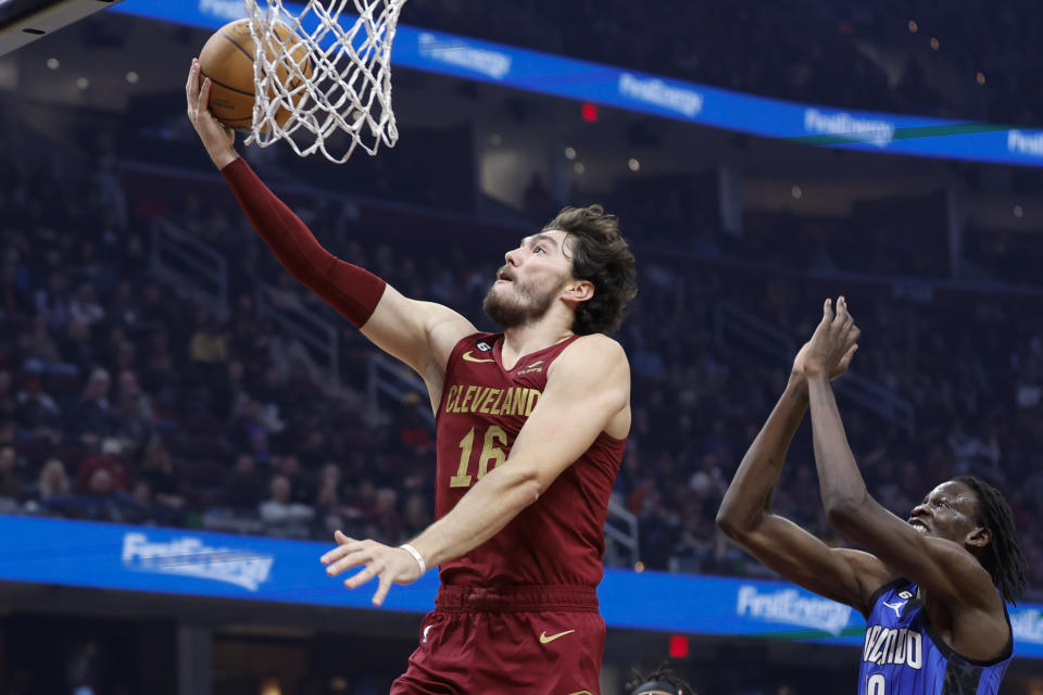 Cleveland Cavaliers forward Cedi Osman (16) shoots against Orlando Magic center Bol Bol (10) during the first half of a NBA basketball game, Wednesday, Oct. 26, 2022, in Cleveland. (AP Photo/Ron Schwane)