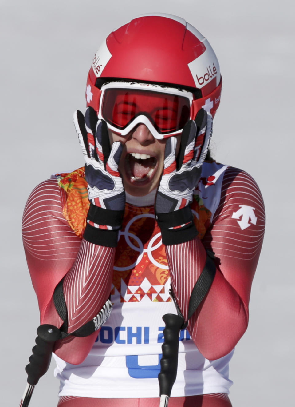 Switzerland's Dominique Gisin reacts after finishing in the women's downhill at the Sochi 2014 Winter Olympics, Wednesday, Feb. 12, 2014, in Krasnaya Polyana, Russia. (AP Photo/Gero Breloer)