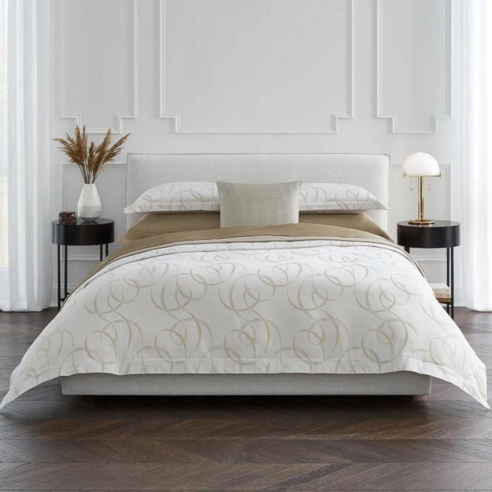 Sferra Caravino Bedding Collection on a bed.