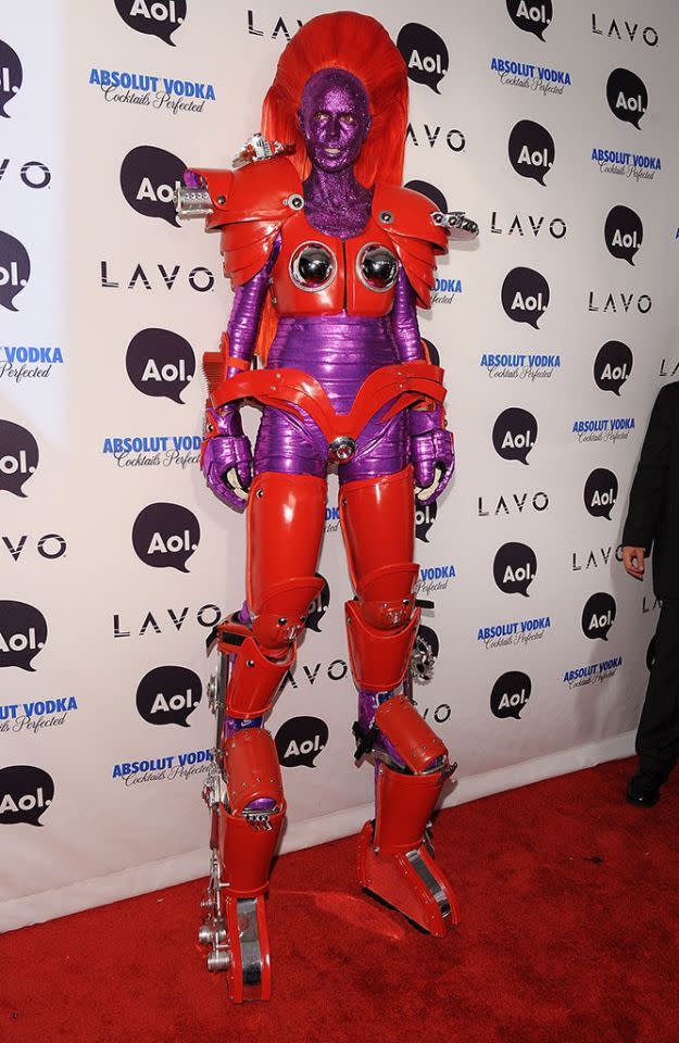 <p>No. 12: In 2010, standing out was not a problem. The<em> America’s Got Talent judge</em> dressed as a Transformer with special boots, which boosted her height to 8 feet tall. Her costume included a purple glitter mask, colored contacts, and cool zigzag choppers. (Photo by Bryan Bedder/Getty Images) </p>