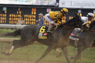 FILE - Jockey Rosie Napravnik is seen aboard Mylute during the 139th running of the Kentucky Derby at Churchill Downs in Louisville, Ky., Saturday, May 4, 2013. (AP Photo/Gregory Payan, File)