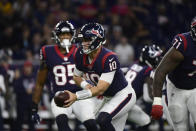 Houston Texans quarterback Davis Mills (10) looks to hand the ball off during the first half of an NFL football game against the Carolina Panthers Thursday, Sept. 23, 2021, in Houston. (AP Photo/Justin Rex)