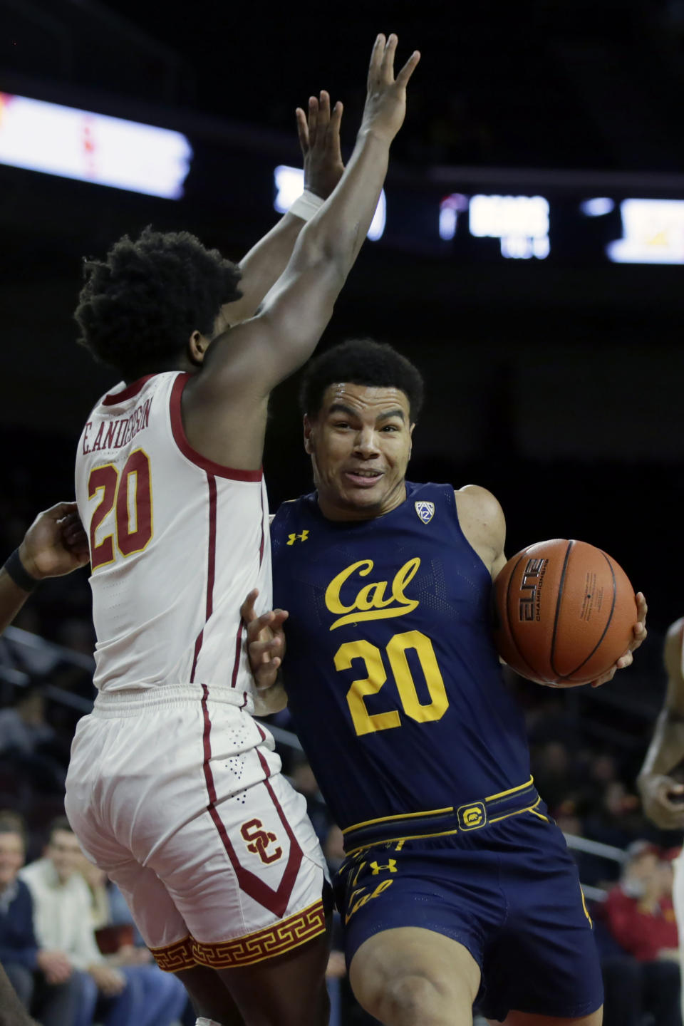 California guard Matt Bradley, right, collides with Southern California guard Ethan Anderson, left, during the first half of an NCAA college basketball game in Los Angeles, Thursday, Jan. 16, 2020. (AP Photo/Alex Gallardo)