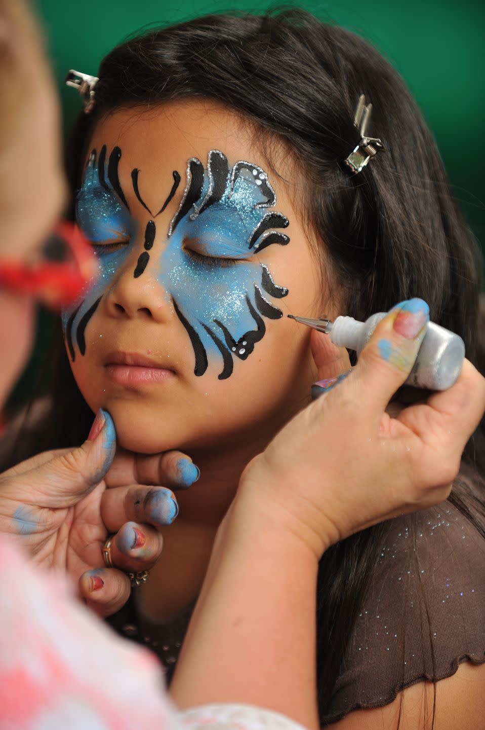 <p>You don't have to be an artist to have fun with face paint. Ask your kids which design they'd like and do your best to paint it. They can even take turns painting each others' faces if they'd like.</p><p><a class="link " href="https://www.amazon.com/JOYIN-Non-Toxic-Ultimate-Including-Superbowl/dp/B075FH22G4/?tag=syn-yahoo-20&ascsubtag=%5Bartid%7C10055.g.33796718%5Bsrc%7Cyahoo-us" rel="nofollow noopener" target="_blank" data-ylk="slk:SHOP FACE PAINT;elm:context_link;itc:0;sec:content-canvas">SHOP FACE PAINT</a></p>