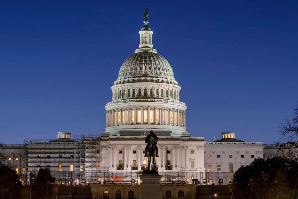 The U.S. Capitol building is seen before sunrise on Capitol Hill in Washington on March 21, 2022.