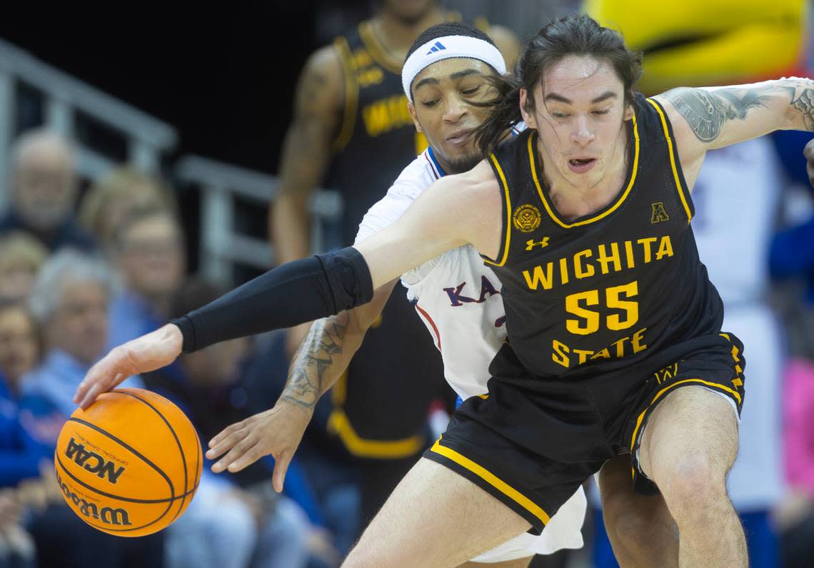 Wichita State’s Bijan Cortes has the ball stolen by Kansas’ Dajuan Harris Jr., during the first half of their game at the T-Mobile Center on Saturday.