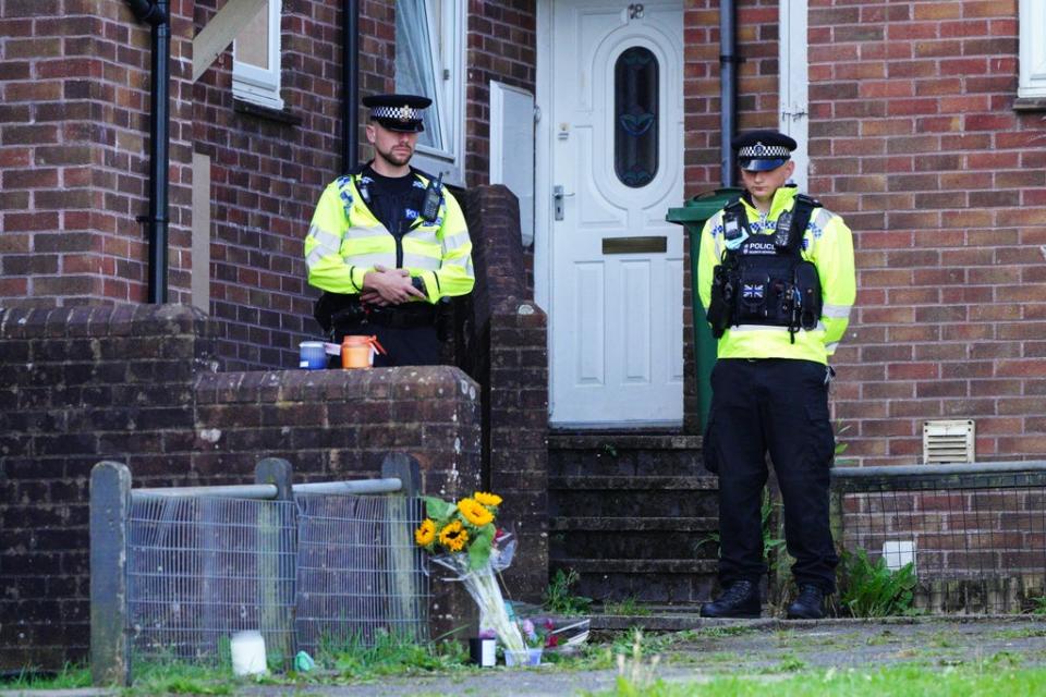 Floral tributes left outside the scene of the first shooting in Biddick Drive, Keyham (PA) (PA Wire)