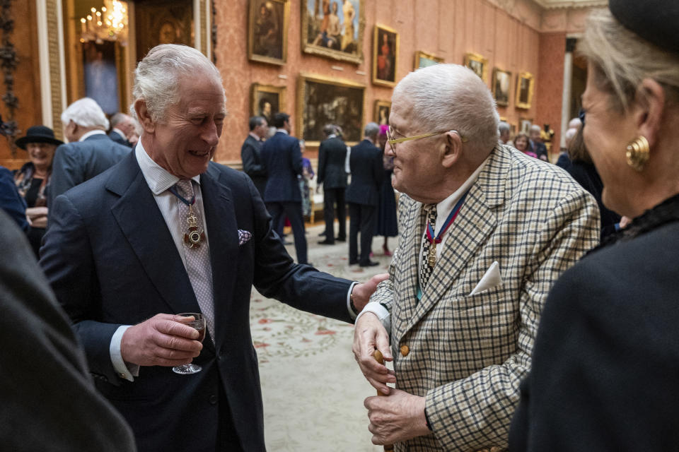 Britain's King Charles III talks with artist David Hockney during a luncheon for Members of the Order of Merit at Buckingham Palace in London, Thursday, Nov. 24, 2022. (Aaron Chown/Pool via AP)