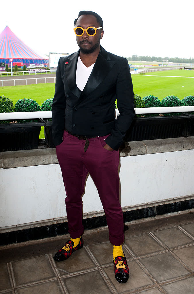 Oh, look! Black Eyed Peas frontman will.i.am is wearing fug socks with bedazzled bedroom slippers ... again. How refreshing? (7/12/2012)