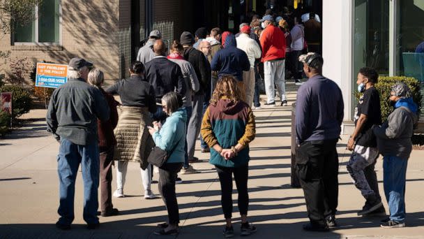 PHOTO: Voters line up at Metropolitan Library to cast their ballots in the runoff election for the Senate position, between Democratic incumbent Raphael Warnock and Republican candidate Herschel Walker, in Atlanta, on Nov. 29, 2022. (Megan Varner/Reuters)