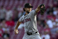 Arizona Diamondbacks pitcher Zac Gallen throws during the first inning of a baseball game against the Cincinnati Reds Tuesday, May 7, 2024, in Cincinnati. (AP Photo/Jeff Dean)