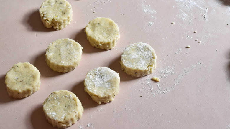 cutting scones out of dough