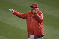 Los Angeles Angels manager Joe Maddon gestures toward umpires during the eighth inning of a baseball game between the Oakland Athletics and the Angels in Oakland, Calif., Friday, July 24, 2020. (AP Photo/Jeff Chiu)