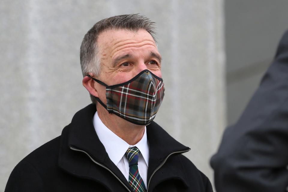 Vermont Gov. Phil Scott stands on the steps of the Vermont Statehouse during a ceremony where he took the Oath of Office on Thursday, Jan. 7, 2021 in Montpelier.