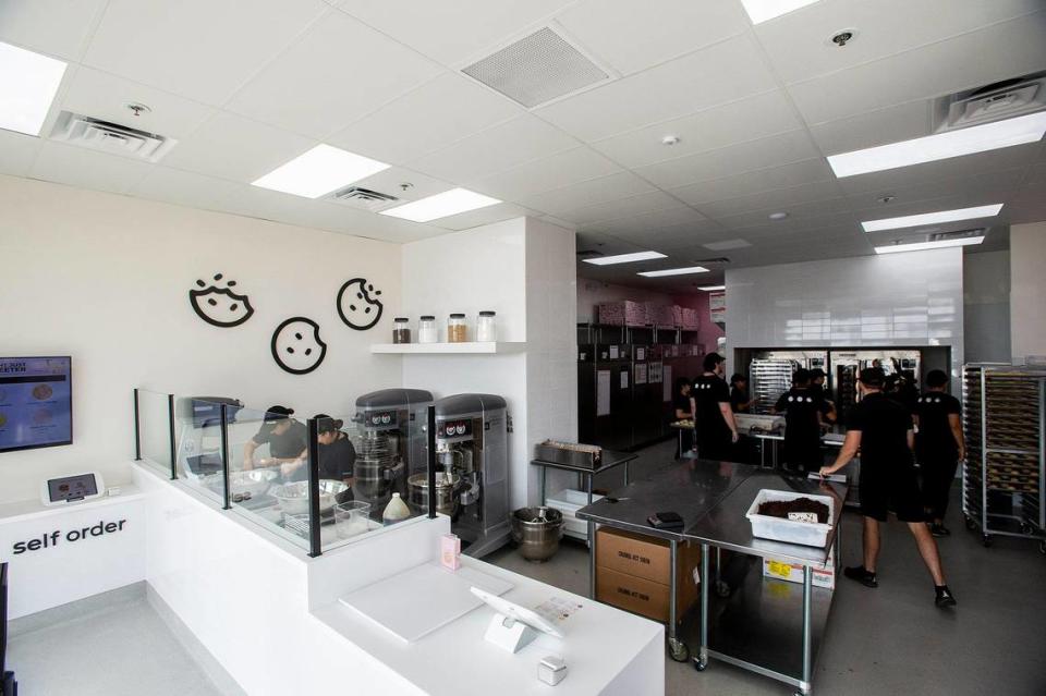 Employees inside the new Crumbl Cookies, location at 3630 G Street, Suite E, in the new Yosemite Crossing shopping center in Merced, Calif., on Wednesday, June 7, 2023. The location’s grand opening is scheduled for June 9.