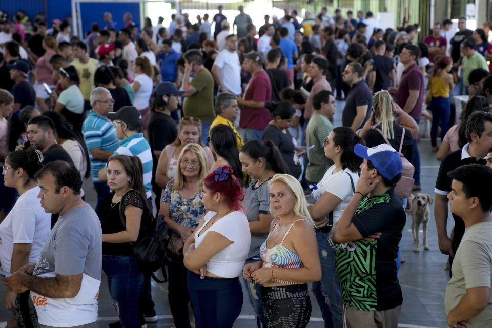 Voters line up during general elections in Asuncion, Sunday, April 30, 2023. (AP Photo/Jorge Saenz)