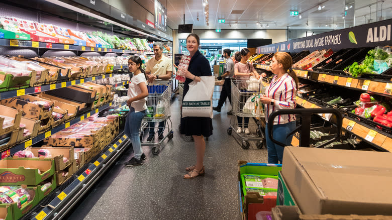 shoppers in Aldi aisle