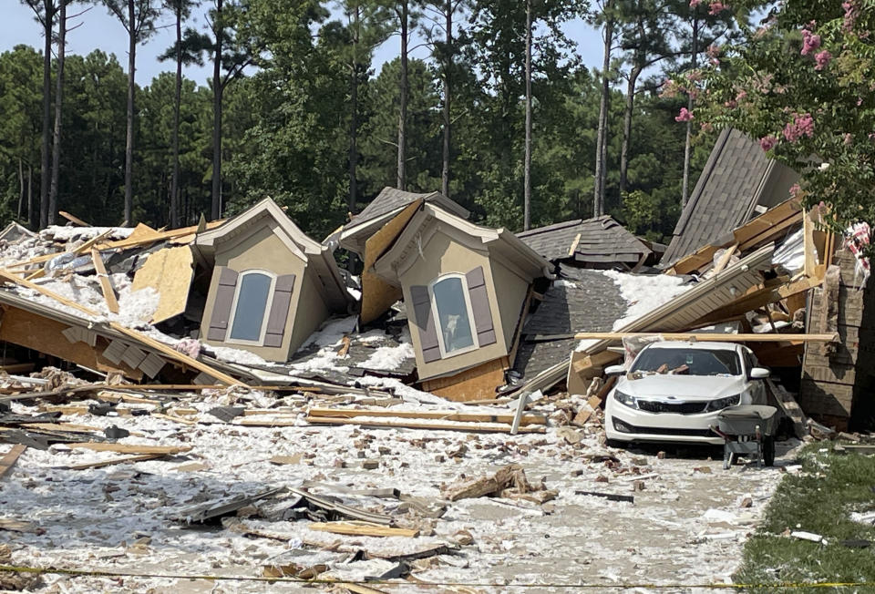 Damage and debris from a house explosion are seen in Mooresville, N.C., Tuesday, Aug. 22, 2023. Robert M. Farley, father of Tennessee Titans cornerback Caleb Farley, died overnight in the explosion that destroyed the NFL player's North Carolina home and left another person injured, authorities said. (AP Photo/Steve Reed)