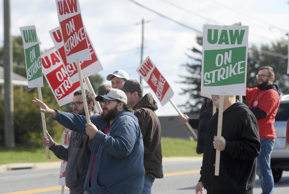 Members of UAW Local 171 picket outside a Mack Trucks facility in Hagerstown, Md. after going on strike Monday, Oct. 9, 2023. Workers voted down a tentative five-year contract agreement that negotiators had reached with the company. (AP Photo/Steve Ruark)