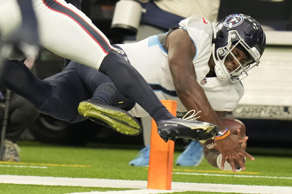 Tennessee Titans quarterback Malik Willis is pushed out of bounds short of the goal line during the second half of an NFL football game against the Houston Texans Sunday, Oct. 30, 2022, in Houston. (AP Photo/Eric Christian Smith)