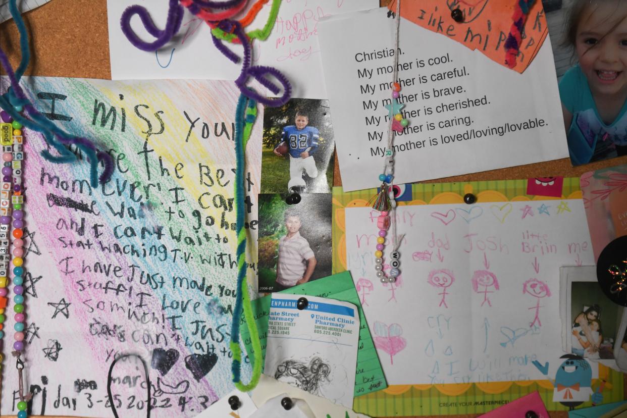 A wall artwork and letters from Christian Banley’s children, inside of her home in Aberdeen, South Dakota, on Wednesday, Aug. 23, 2023.