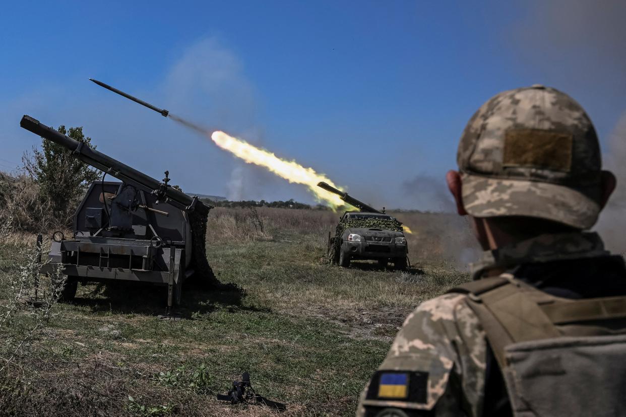 Ukrainian servicemen fire small multiple launch rocket systems towards Russian troops (REUTERS)