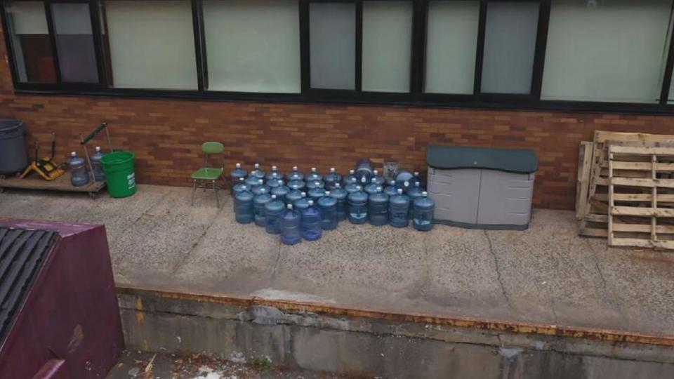 PHOTO: Empty water cooler bottles that served some East Ramapo Central School District students due to the lead issue sit outside a school in Rockland County, N.Y. (ABC News)