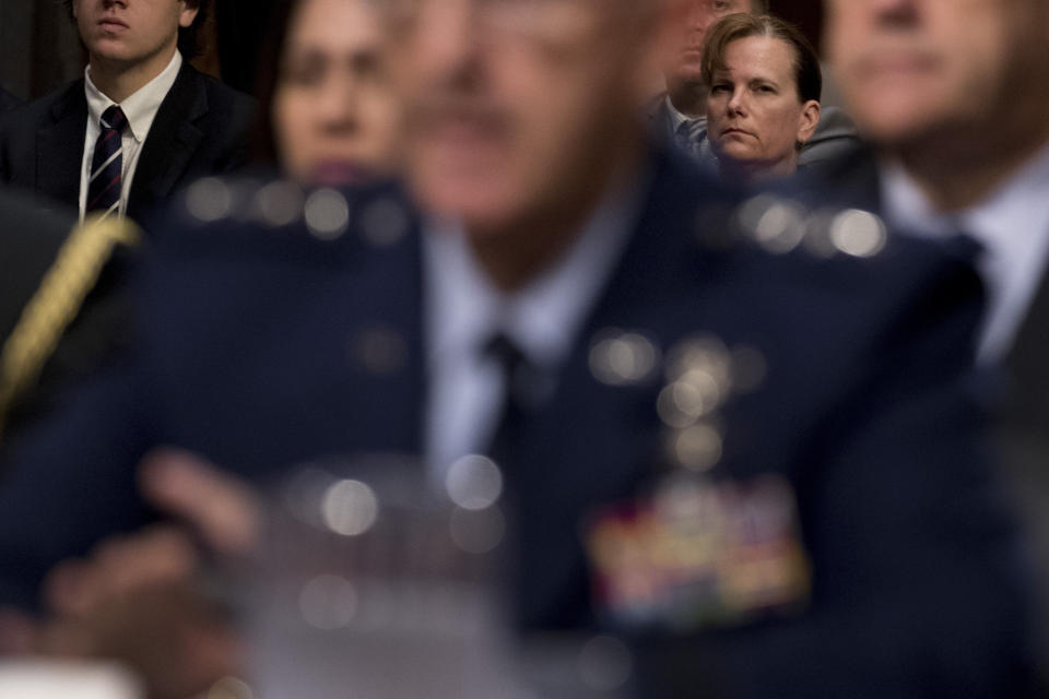 Former aide Army Col. Kathryn Spletstoser, right, sits in the audience as Gen. John Hyten, foreground, appears before a Senate Armed Services Committee on Capitol Hill in Washington, Tuesday, July 30, 2019, for his confirmation hearing to be Vice Chairman of the Joint Chiefs of Staff. (AP Photo/Andrew Harnik)