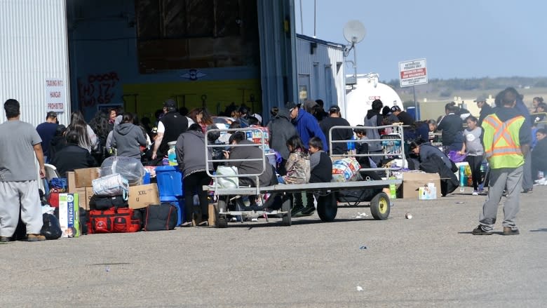 'Everybody's anxious': 1,800 wildfire evacuees wait for flights home from Winnipeg and Brandon