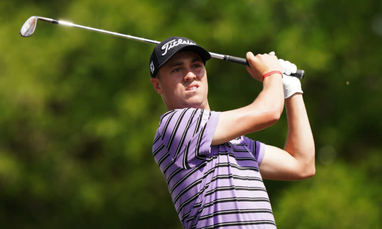 Justin Thomas swinging a golf club.