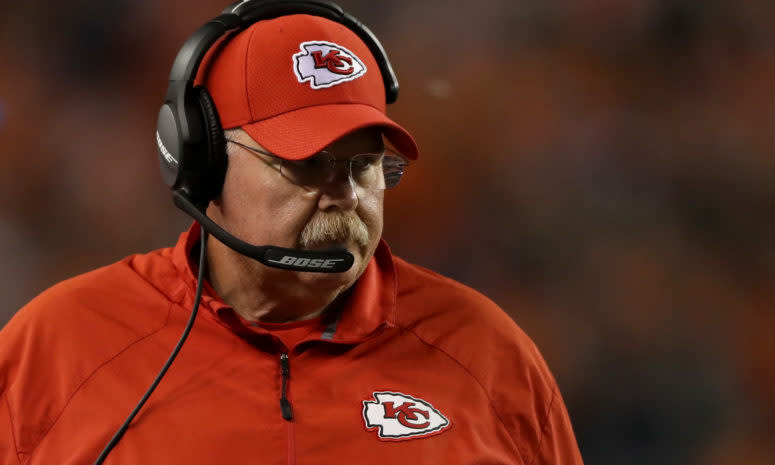 A closeup of Andy Reid wearing all Kansas City Chiefs gear.