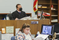 Judge Blaine K. Bowman listens to testimony during the Kellen Winslow II (video screen bottom right) sentencing hearing at the Superior Court North County Division on Wednesday, March 3, 2021 in Vista, Calif. Winslow was sentenced to 14 years in prison on rape and other charges. (Eduardo Contreras/The San Diego Union-Tribune via AP, Pool)