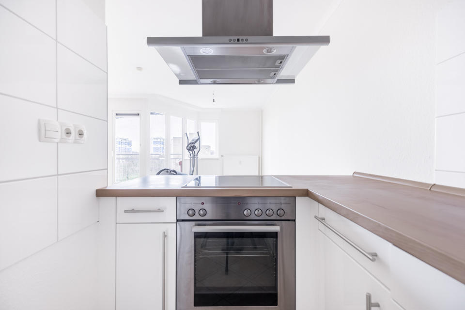 A modern, white kitchen.