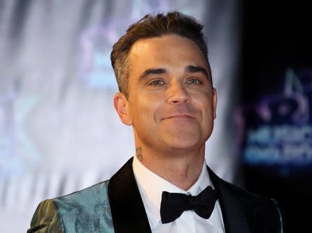 FILE PHOTO: Singer Robbie Williams arrives to attend the NRJ Music Awards ceremony at the Festival Palace in Cannes