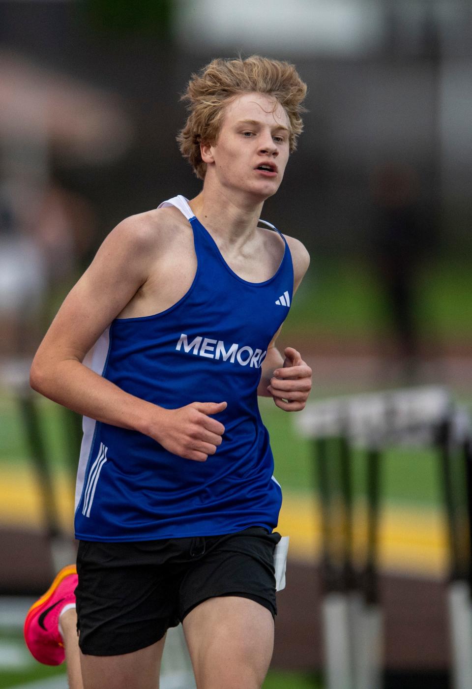 Memorial’s Andrew Foster leads in the 1600 meter run during the 2024 IHSAA Boys Track & Field Sectional 32 at Central High School Thursday, May 16, 2024.