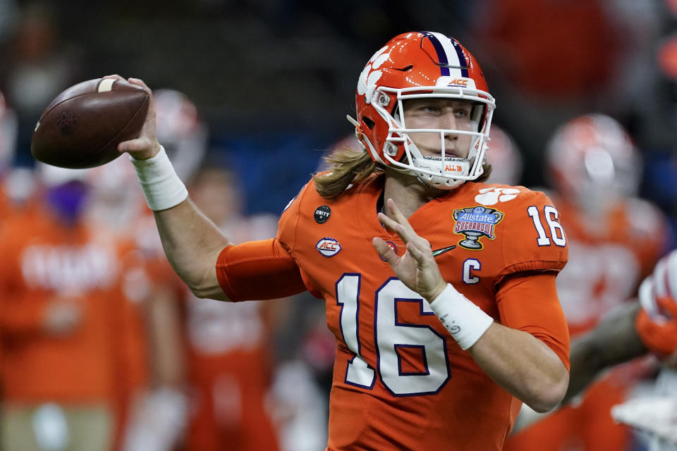 FILE - In this Friday, Jan. 1, 2021 file photo, Clemson quarterback Trevor Lawrence passes against Ohio State during the first half of the Sugar Bowl NCAA college football game in New Orleans. The last NFL event not impacted by the COVID-19 pandemic was the 2020 combine in Indianapolis. A year later, with the 2021 combine canceled, the league has released a list of players who would have merited invitations. From such high-profile quarterbacks as Clemson’s Trevor Lawrence and Ohio State’s Justin Fields to guys who sat out last season such as Oregon tackle Penei Sewell, there are 323 players from 100 schools. (AP Photo/John Bazemore, File)