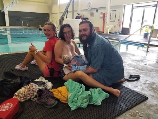 PHOTO: YMCA lifeguard Natalie Lucas and YMCA members Tessa and Matthew Rider after the Riders welcomed their third child on the pool deck, July 24, 2022, at the Y in Longmont, Colo. (Courtesy YMCA of Northern Colorado)