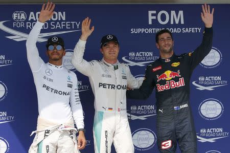 Hungary Formula One - F1 - Hungarian Grand Prix 2016 - Hungaroring, Hungary - 23/7/16 Mercedes' Lewis Hamilton and Nico Rosberg with Red Bull Racing's Daniel Ricciardo after qualification REUTERS/Laszlo Balogh