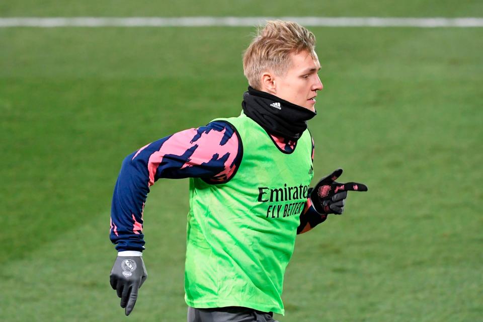 <p>Arsenal are optimistic over signing Martin Odegaard from Real Madrid</p> (AFP via Getty Images)