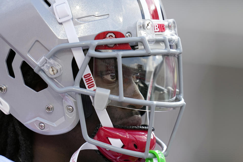 FILE - Ohio State wide receiver Marvin Harrison Jr. (18) watches during the second half of an NCAA college football game against Indiana, Saturday, Sept. 2, 2023, in Bloomington, Ind.Harrison is a finalists for the Heisman Trophy. (AP Photo/Darron Cummings, File)