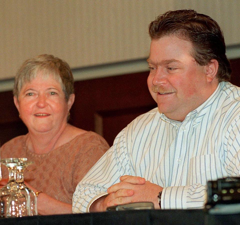 In this Oct. 28, 1996 photo, Richard Jewell, cleared of suspicion in the Olympic Park bombing, and his mother Barbara, face the media as Jewell's attorney Lin Wood addressed the press conference in Marietta, Ga. When a bomb exploded in a downtown Atlanta park midway through the 1996 Olympics, it set news reporters and law enforcement on a collision course that upended the life of a security guard, turning him from hero to villain overnight. Now, more than 20 years later, a recent book and upcoming movie explore Jewell's ordeal and the roles played by law enforcement and the media. (AP Photo/Ric Feld, File)