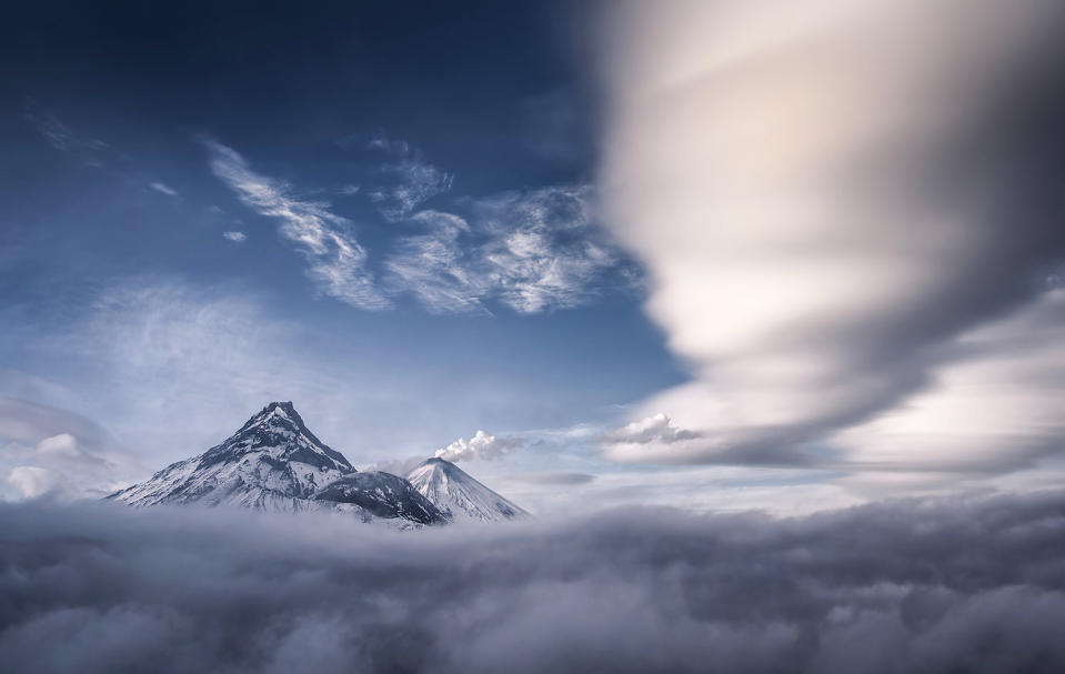 Stunning images capture ‘UFO’ clouds surrounding volcano 