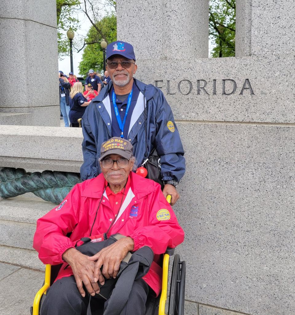 World War II veteran Herman Jenkins, seat, is shown last year as he joined other veterans in flying from Lakeland  in Washington, D.C. as part of the Honor Flight ceremony. Terry Coney of Lakeland accompanied him. Jenkins died Friday at age 104.