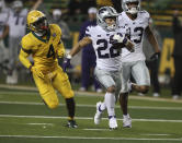 Kansas State running back Kaelen Shankle, centef, scores past Baylor safety Christian Morgan, left, during the second half of an NCAA college football game Saturday, Nov. 28, 2020, in Waco, Texas. (Rod Aydelotte/Waco Tribune Herald via AP)