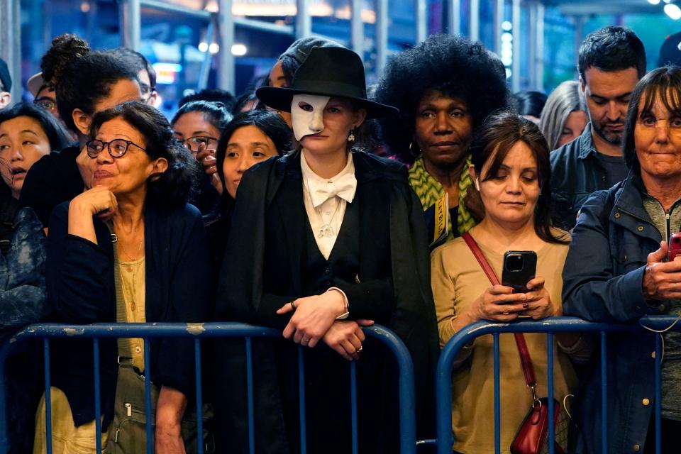 Fans wait outside the Majestic Theatre during the final performance of "Phantom" on Broadway.