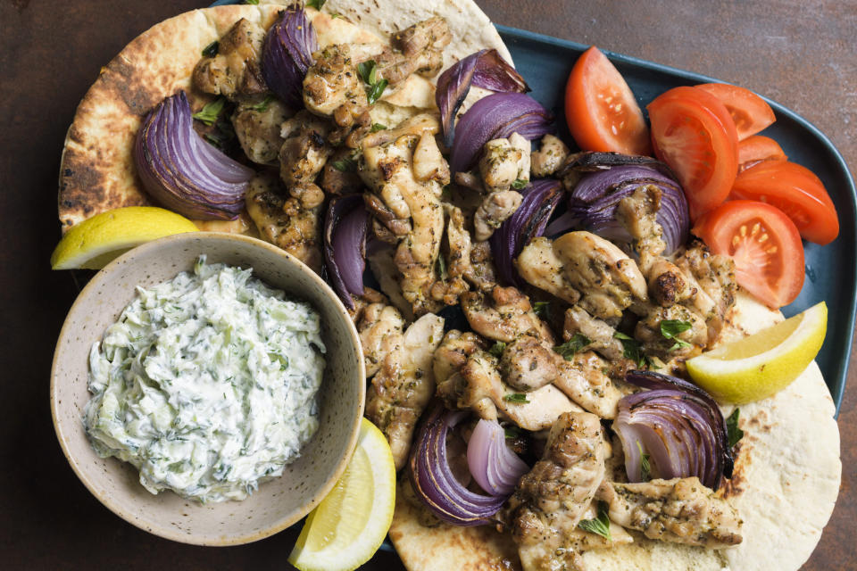 This image released by Milk Street shows a recipe for chicken souvlaki with tzatziki. (Milk Street via AP)