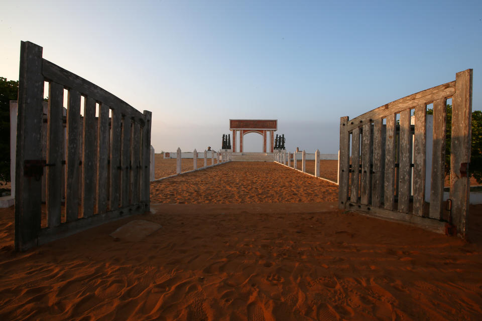 Open gates are seen before a monument at the site of the 'Point of No Return' where slaves were loaded onto ships in the historic slave port of Ouidah, Benin. (Photo: Afolabi Sotunde/Reuters)