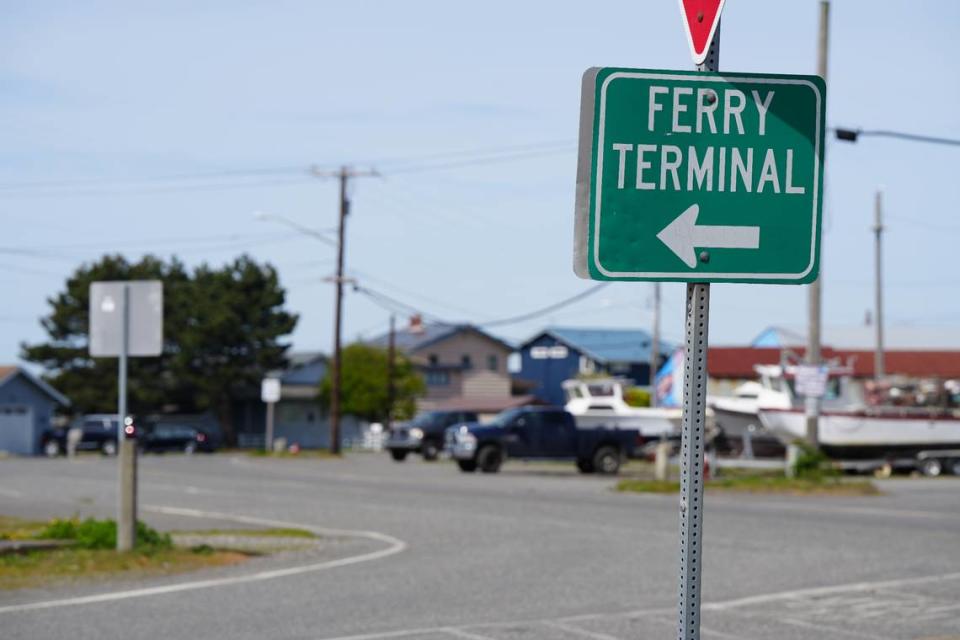 A sign points cyclists, pedestrians and vehicles toward the Lummi Island ferry terminal on the Lummi Nation mainland.
