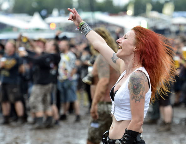 A festival goer enjoys the Wacken Open Air heavy metal music fest on August 3, 2012 in Wacken, Germany. Approximately 75,000 heavy metal fans from all over the world have descended on the north German village of 1,800 residents for the annual three-day fest. (Photo by Patrick Lux/Getty Images)