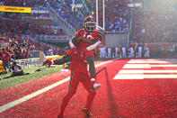 Utah wide receiver Money Parks (10) celebrates with a teammate after scoring against Florida during the first half of an NCAA college football game Thursday, Aug. 31, 2023, in Salt Lake City. (AP Photo/Rick Bowmer)